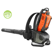 Side view of a Husqvarna backpack leaf blower in a studio, with a certification badge.