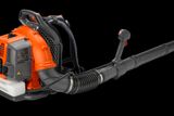 Side view of a backpack leaf blower with ergonomic handle and nozzle.