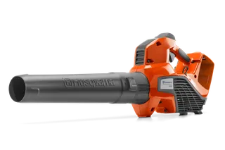 Side view of a Husqvarna leaf blower showcasing its design and nozzle.