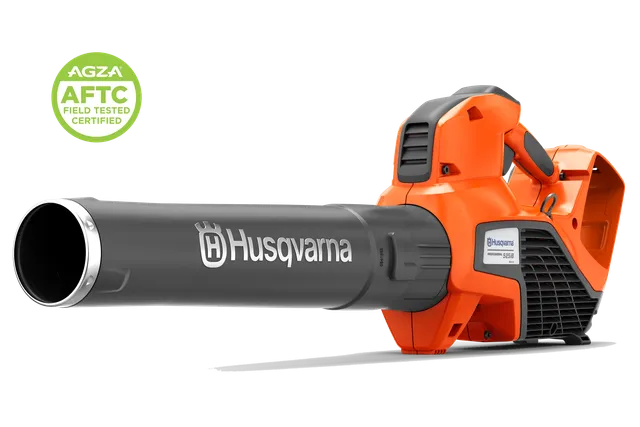 Side view of a Husqvarna handheld leaf blower with an AGZA AFTC certified badge.