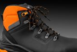Side view of a work boot with laces and reinforced ankle support.