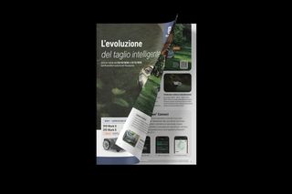 Open magazine displaying pages with gardening tools and technology features.