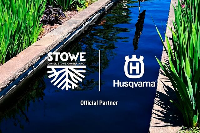 A scenic garden view with a long, narrow water feature lined with plants and flowers, featuring Stowe and Husqvarna logos, indicating a partnership.