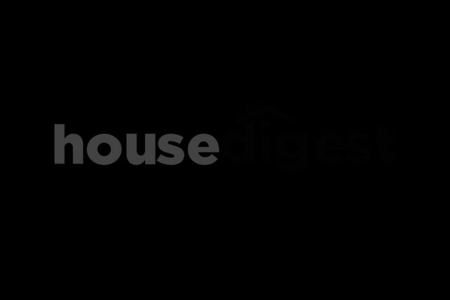 Logo of House Digest with a stylized house roof over the text.