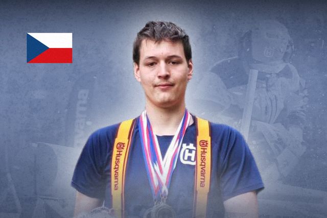 A person wearing Husqvarna branded gear with medals, Czech flag visible.