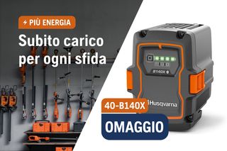 A Husqvarna battery charger with a display showing 'BLI200' and various Husqvarna tools hanging on a wall.