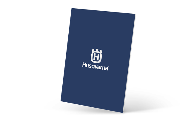 Husqvarna branded notebook with a blue cover.