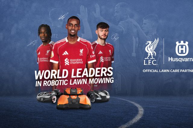 Three robotic lawn mowers before football players; L.F.C. and Husqvarna logos with partnership text.