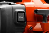 Close-up view of a power tool's start button and handle.