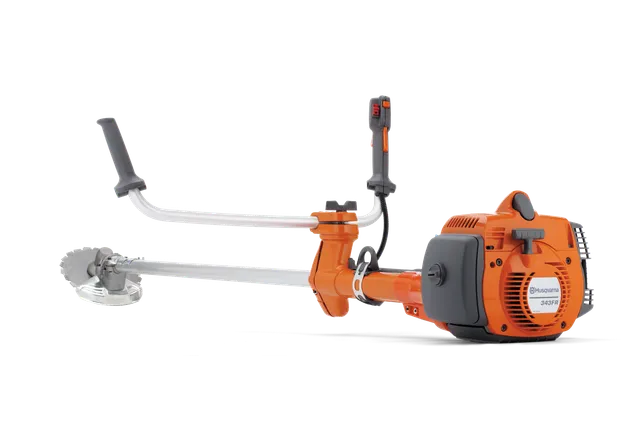 Side view of a Husqvarna brushcutter with ergonomic handles and a cutting blade.