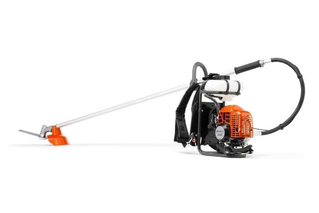 Side view of a Husqvarna backpack brush cutter with a long shaft and cutting blade.
