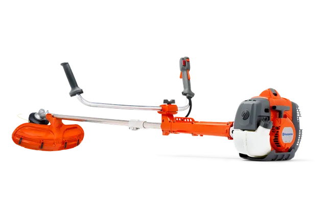 Zijaanzicht van een Husqvarna bosmaaier met ergonomisch handvat en zichtbare motor.