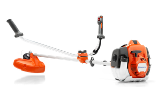 Side view of a Husqvarna brush cutter with ergonomic handles and visible engine.