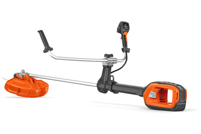 Husqvarna 525iRXT. Side view of a Husqvarna brush cutter with ergonomic handle and battery compartment.