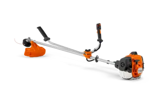 Side view of a brushcutter with ergonomic handle and visible engine.