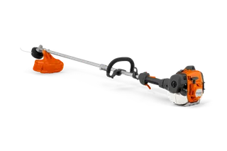 Husqvarna 525RJD Mark II. Side view of a string trimmer with visible engine and cutting head.