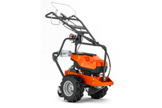 Side view of a heavy-duty garden tiller with large wheels and ergonomic handle.