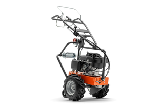 Stranski pogled na motor gradbenega vrtalnika Husqvarna z ergonomskim ročajem.