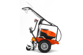Side view of a construction power tool with large wheels and a handlebar.