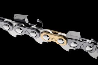 Close-up view of a chainsaw chain with a mix of silver and gold links.
