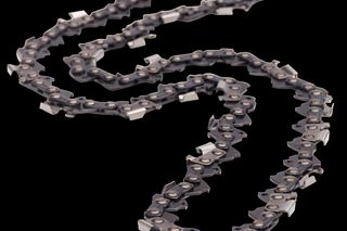 Top view of a chainsaw chain laid out on a white surface.