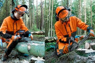 A person in work gear using a chainsaw to cut a tree log in a forest.