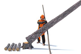 A person in work gear using a chainsaw to cut a large tree trunk, with logs and a stump nearby.