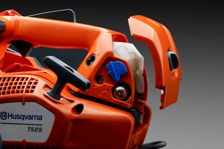 Side view of a Husqvarna T525 chainsaw showcasing the air filter compartment.