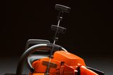 Side view of a chainsaw with multiple positions of the pull starter handle shown.