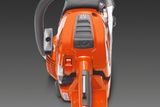 Rear view of a Husqvarna chainsaw with visible controls and handle.