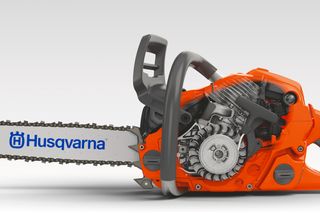 Side view of a Husqvarna chainsaw showcasing its detailed engine and blade.