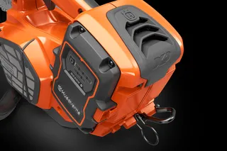 Close-up view of a Husqvarna battery compartment on a power tool.