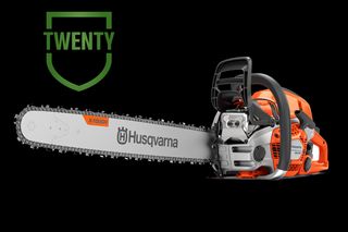 Side view studio shot of a Husqvarna chainsaw showing the guide bar and chain.