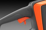 Close-up of a chainsaw handle showing the trigger handle.