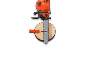 Top view of a chainsaw cutting through a wooden log.