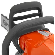 Close-up view of a Husqvarna chainsaw handle and chain.