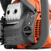 Close-up view of a chainsaw's engine and control panel.