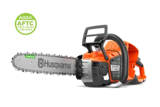 Side view studio image of a Husqvarna chainsaw with guide bar and chain, with an AGZA AFTC field-tested certified badge visible in the corner.