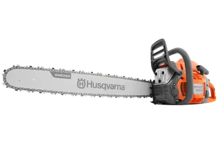 Side view of a Husqvarna chainsaw with a visible blade and handle.