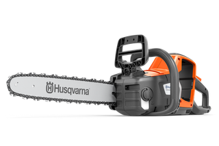 Side view of a Husqvarna chainsaw with visible chain and handle.