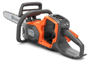 Side view of a Husqvarna chainsaw showcasing its ergonomic handle and battery compartment.
