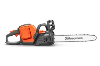 Side view of a Husqvarna chainsaw showcasing its design and features.