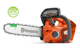 Studio side view of a Husqvarna chainsaw; AGZA AFTC badge at top left.