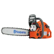 Side view of a Husqvarna chainsaw with visible branding and blade.