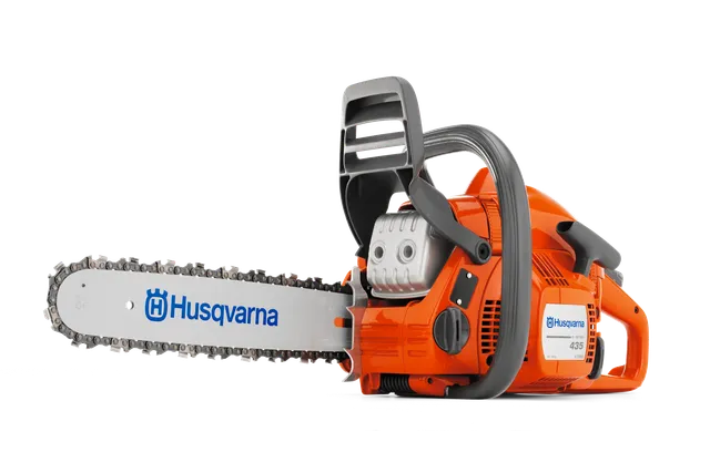 Side view of a Husqvarna chainsaw with visible branding on the blade.