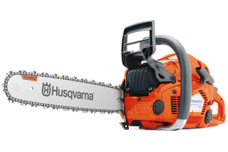 Side view of a Husqvarna chainsaw with X-Force bar and ergonomic handle.