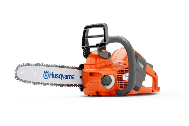 Side view of a Husqvarna chainsaw with visible branding and ergonomic handle.