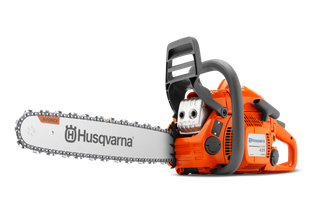 Side view of a Husqvarna chainsaw with X-Torq engine technology.