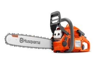 Side view of a Husqvarna chainsaw with X-Torq engine technology.