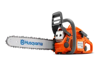 Side view of a Husqvarna chainsaw with its components disassembled.